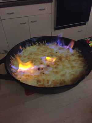 flaming pan of cheese