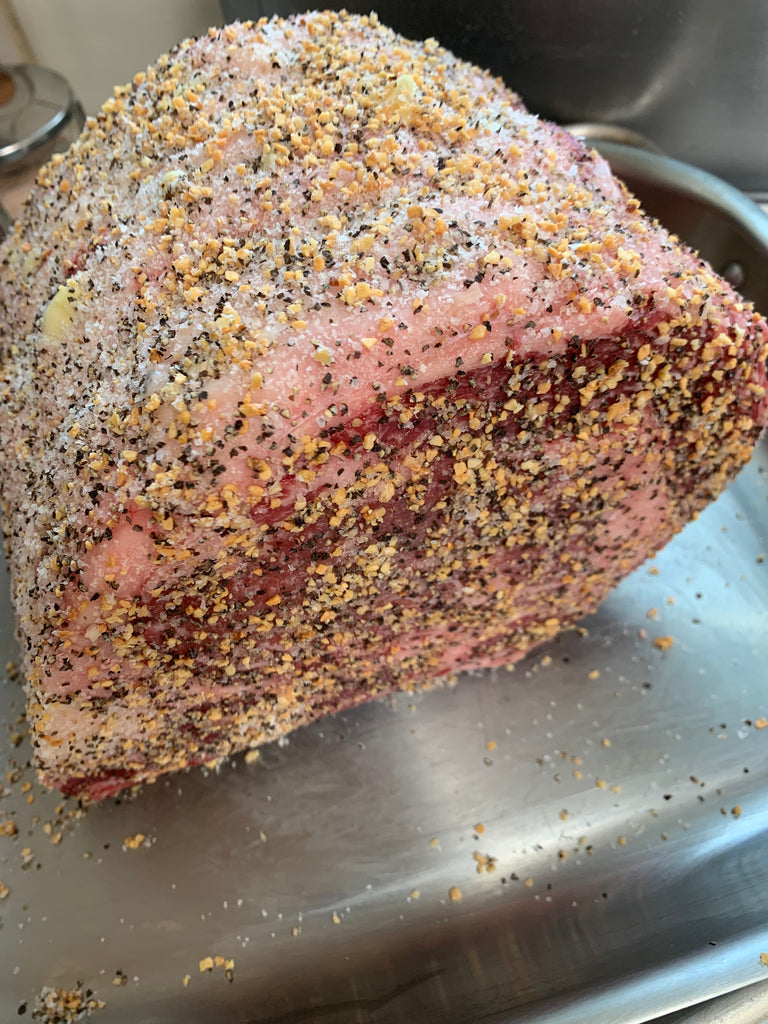 Uncooked prime rib with dry rub